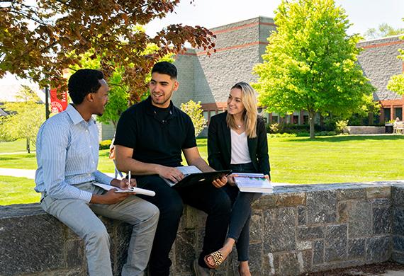 Image of three Marist students working outside