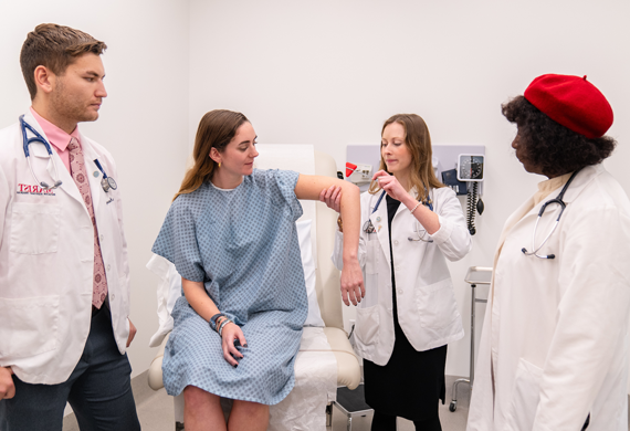 Image of students conducting an examination.