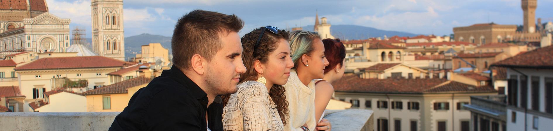 Photo of students looking off a rooftop at Florence