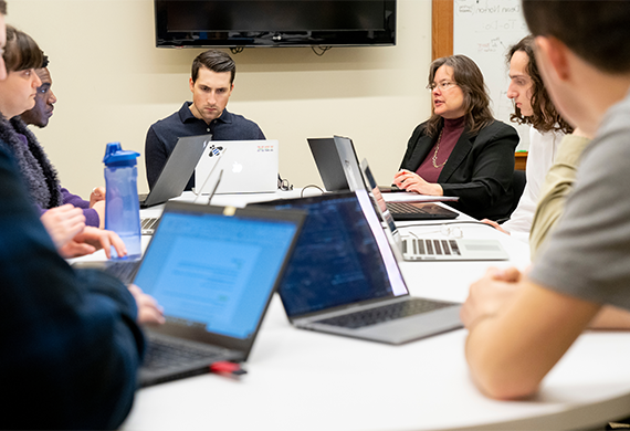 image of Marist students with their computers in class