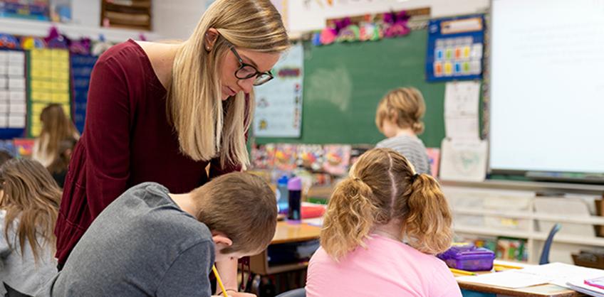 Photo of student teacher with students