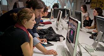 Two studenrts are discussing on watching computer