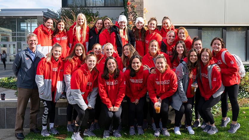 image of president weinman Taking a photo with the Marist Women’s Lacrosse team at the 2021 Hunger Walk