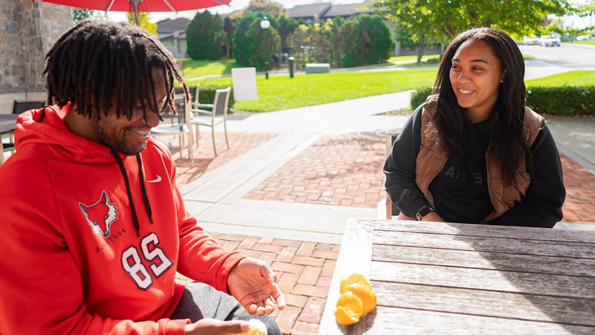 Tristan enjoying the rest of his meal from Yella’s while chatting with Jadyn Lance ’24 at the North End tables. Photo by Yasir Olenja ‘24/Marist College.