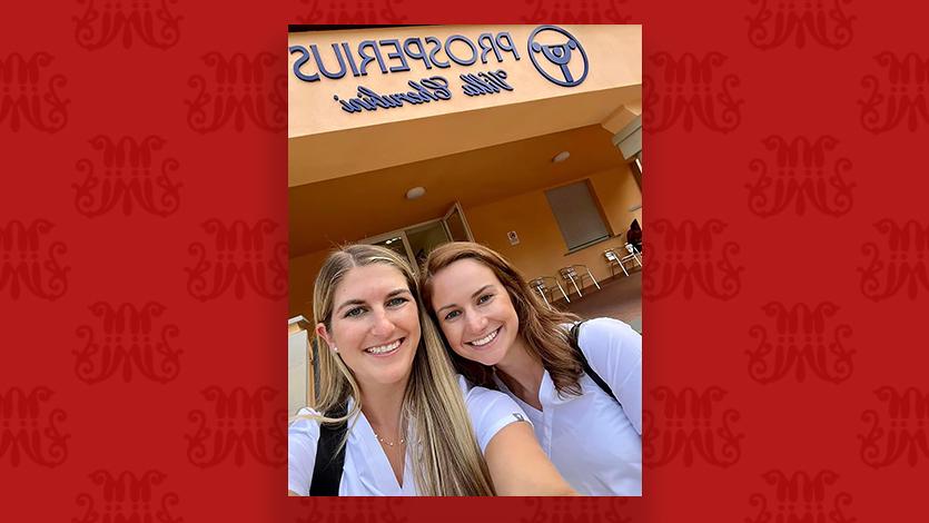 Image of Kelly Boonie (left) and Mary Smyth (right) standing in front of the entrance to their clinic in Fiesole, Italy.