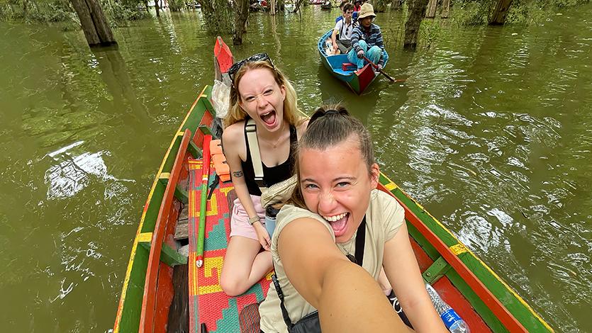 Image of Veronica Vogelman '26 and Elizabeth Granholm '25 touring the Floating Village Kamplong Pluk, Cambodia.