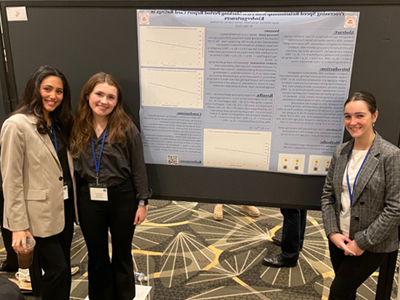 Image of student and faculty member presenting research at the Eastern Psychological Association.