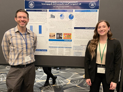 Image of student and faculty member presenting research at the Eastern Psychological Association.